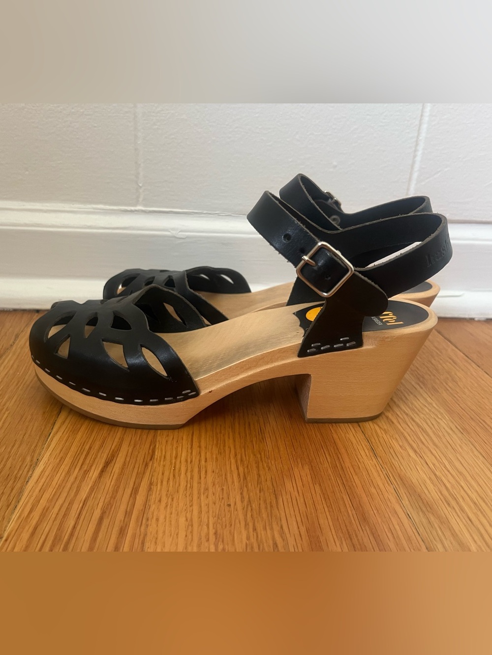Swedish Hasbeens Black Leather Cutout Clogs with Wooden Heel